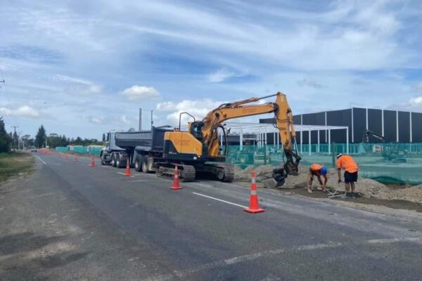 Roading and kerb and channel construction with civil contractors installing stormwater drainage and footpaths as part of an urbanisation project delivered by a civil construction company and earthworks specialists.