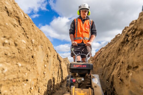 The trench base is compacted to the correct level, forming a stable foundation for drainage infrastructure within the Rolleston subdivision.